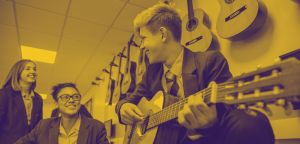 School children learning guitar